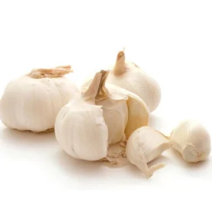 Fresh Chinese garlic bulbs displayed on a counter.